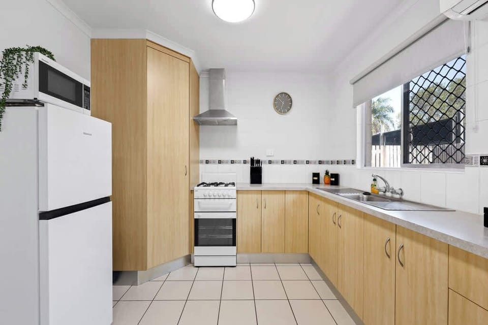 The kitchen is fully equipped with a stove, microwave, and a full-sized fridge, providing everything you need to prepare meals with ease. Whether you're cooking a feast or storing groceries, you'll have all the space and tools required for your stay.