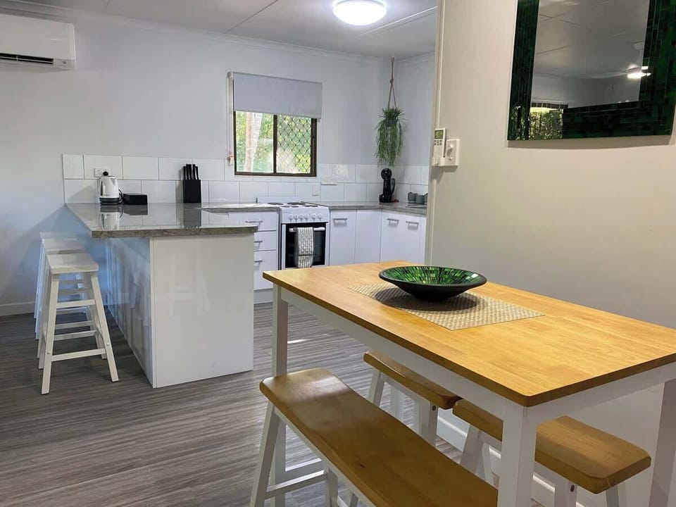 Guests can choose between the cozy dining nook for a more intimate meal or the convenient breakfast bar for a quick bite or casual dining. Both options provide a welcoming space to enjoy your meals, whether starting or finishing your day.