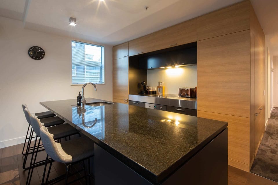 Large kitchen bench for cooking meals for everyone at your family accommodation in Queenstown
