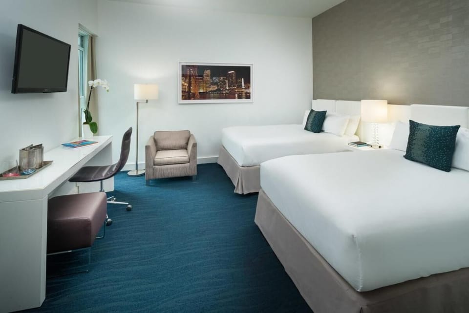Settle in comfortably with roomy layout, desk, and lounge chair.