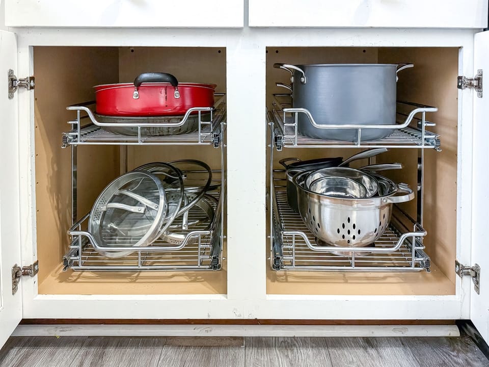 One of several cabinets with the things needed to prepare large meals efficiently.