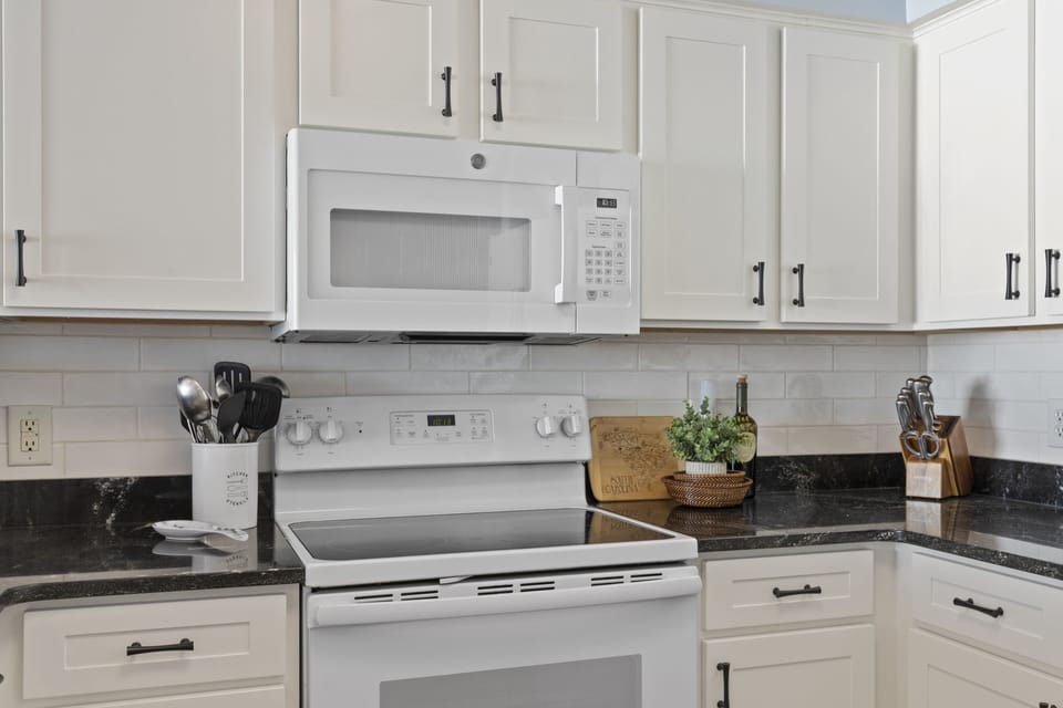New microwave and tiled backsplash