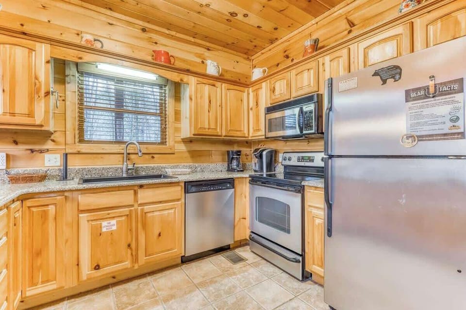 Modern appliances add a beautiful and efficient touch to this high-ceiling, open kitchen.