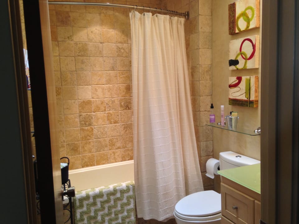 Beautiful custom limestone tile and walls done by owners. Extra deep tub. 