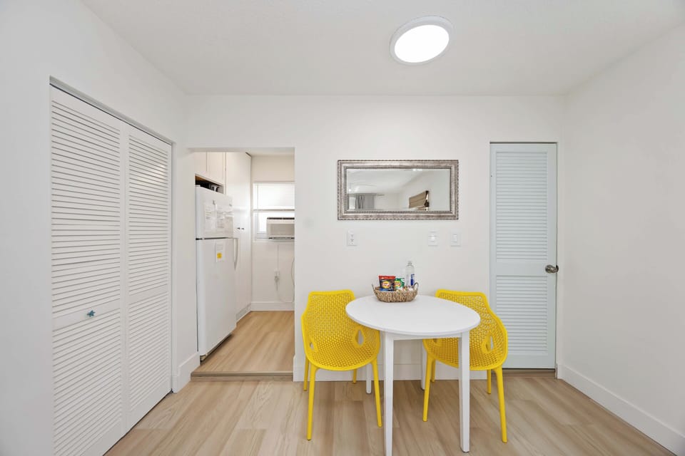 Dining area. There is also an outdoor table by the pool. 