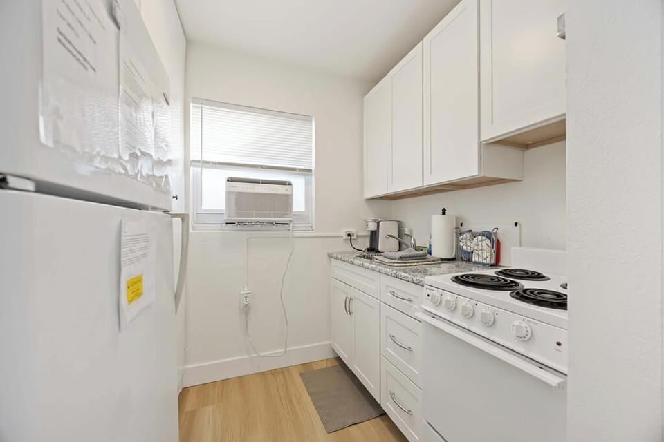 Galley kitchen has full size refrigerator, compact stove, microwave, etc. 