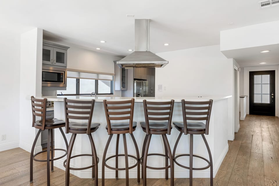 Modern kitchen with barstool seating.