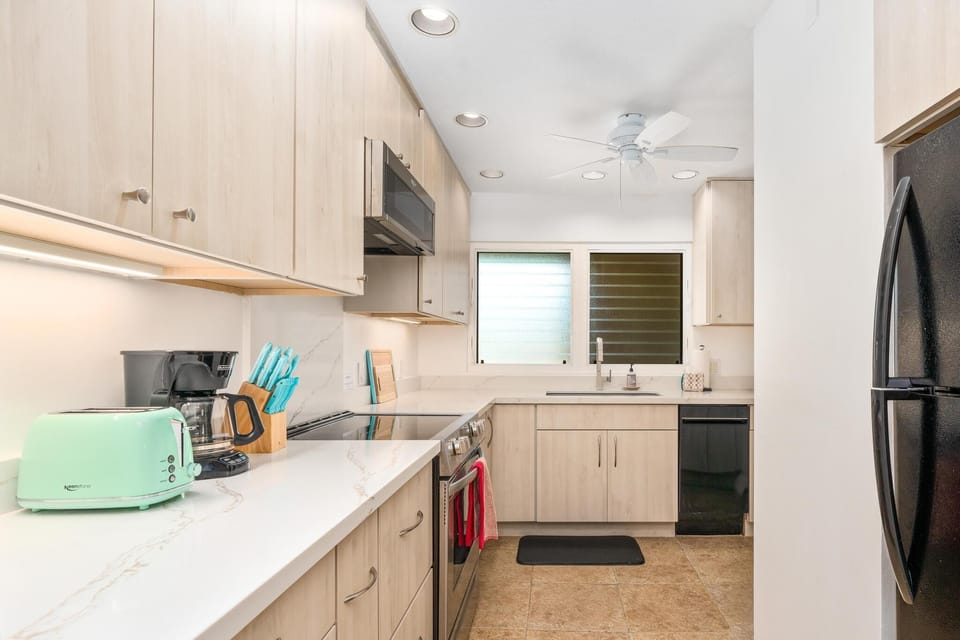 The updated kitchen is light and airy.