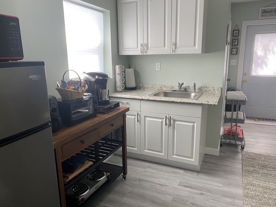 View kitchenette -microwave/medium fridge/toaster oven/stove top burners 