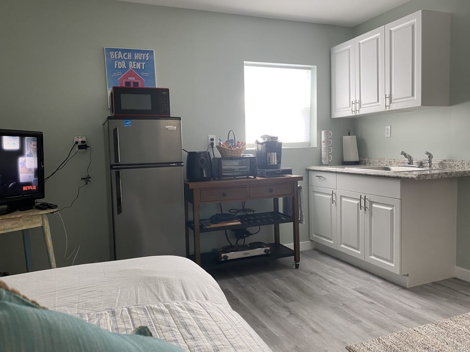 View from bed side looking at kitchenette 