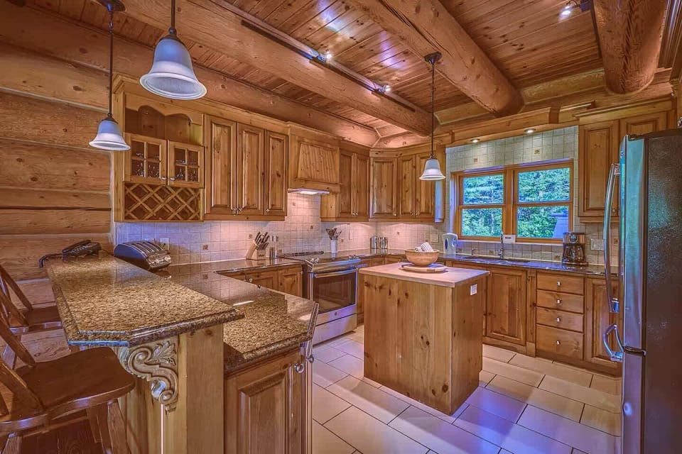 Breakfast bar and kitchen entry framed by beautiful timber beams