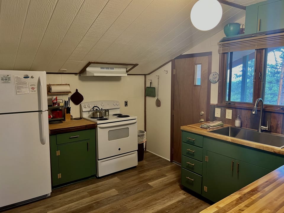 Cutting board counter between stoved and fridge