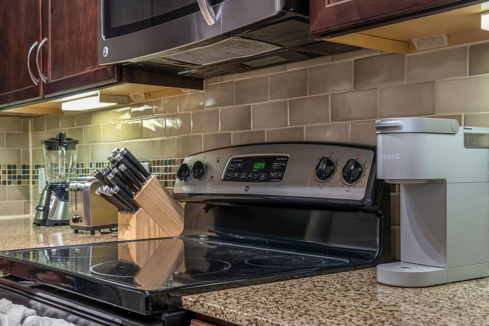 Stainless steel appliances with coffee, blender and other cooking tools to make you feel right at home.
