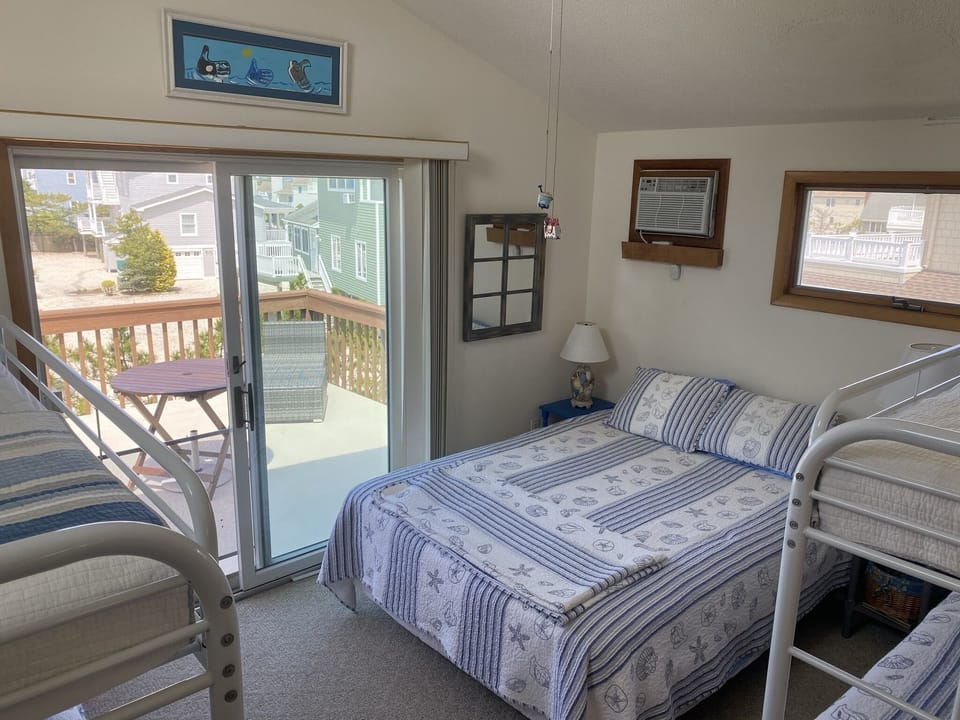 Two sets of bunk bends for the kids.
Upstairs bedroom with small balcony.
