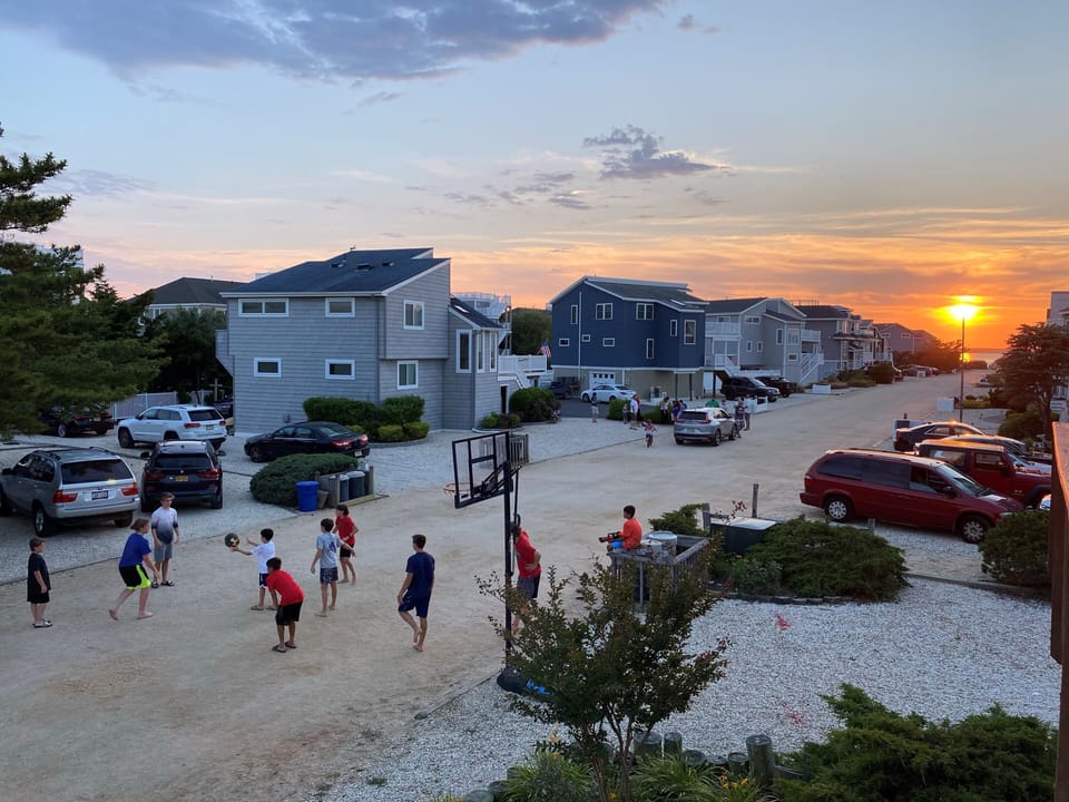 View from the main deck of the kids playing basketball with the neighbors