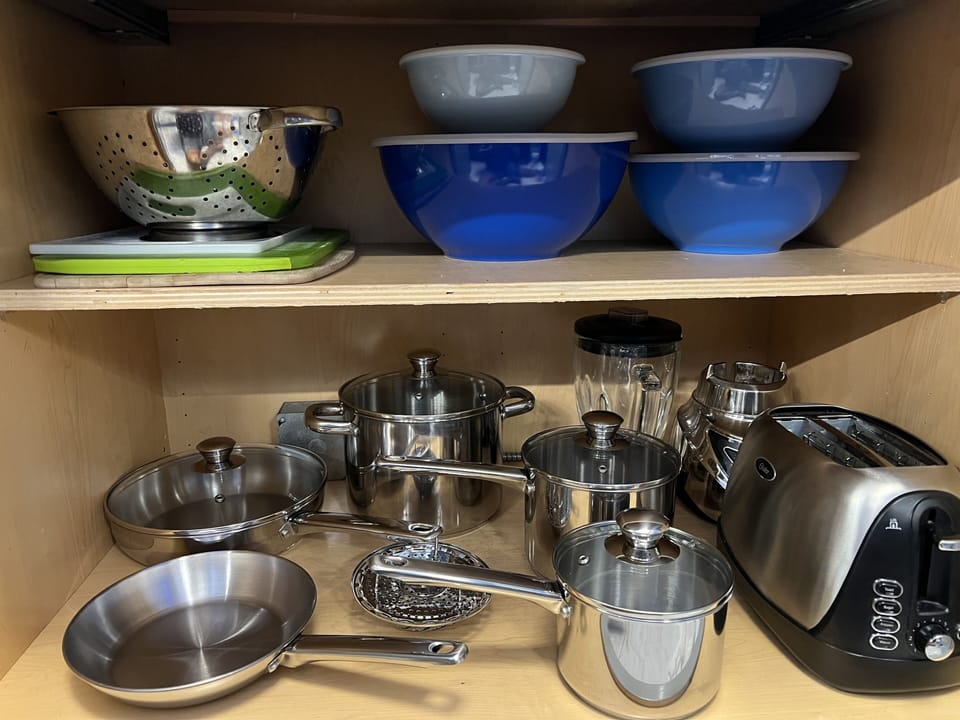 New dishes, silverware, pots and pans. 