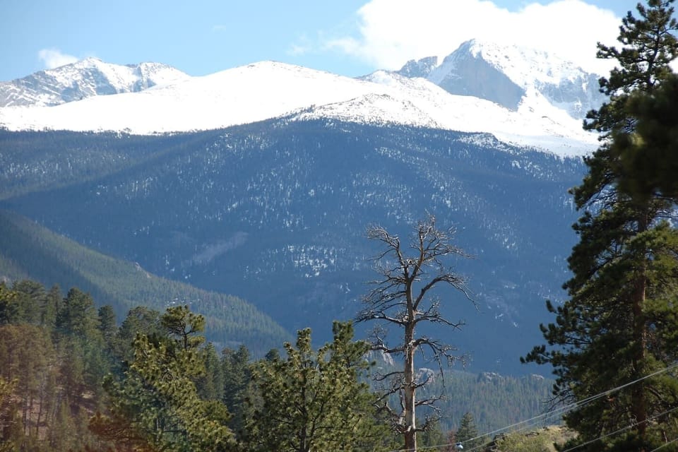 Longs Peak views from both the covered porch and the large picture window in LR