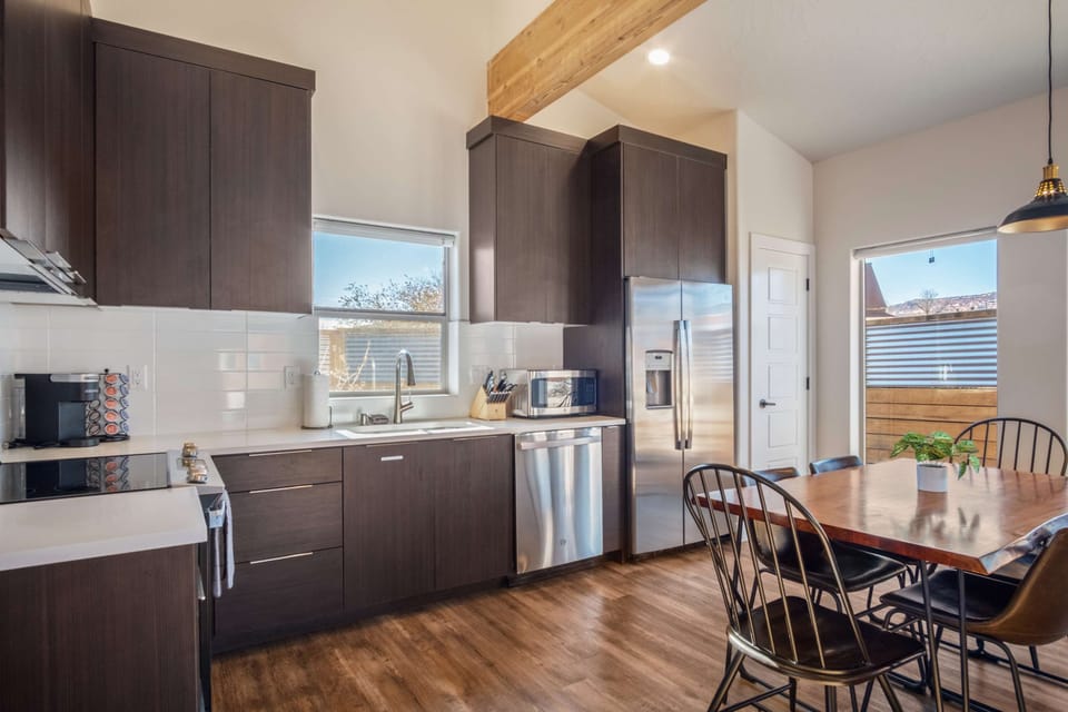 Modern appliances, spacious countertops - this kitchen has everything you need, including a Keurig with pods for your morning brew.