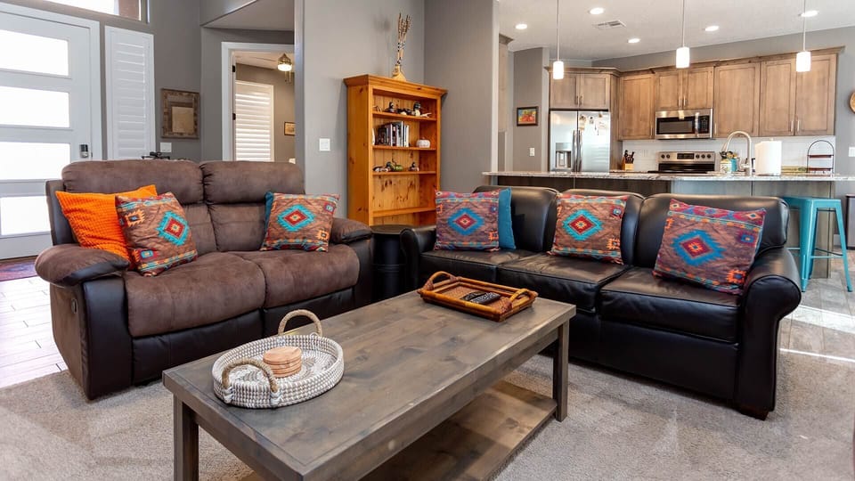 The open floor plan adds to the spaciousness of Red Cliff Retreat. The furniture is both stylish and comfy, and you’ll love watching your favorite shows on the large flat screen.
