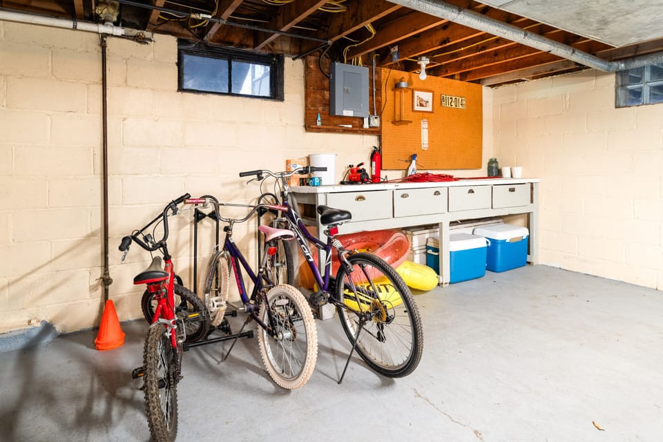 Extra camp chairs, coolers, bikes, and yard games in our basement for guests