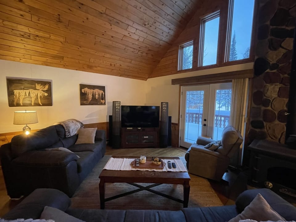 Large living area, couch, loveseat, recliner.