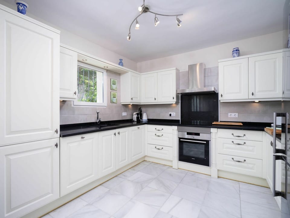 Cabinetry, Countertop, Property, Furniture, Drawer, Wood, Kitchen Appliance, Home Appliance, Kitchen Stove, Interior Design