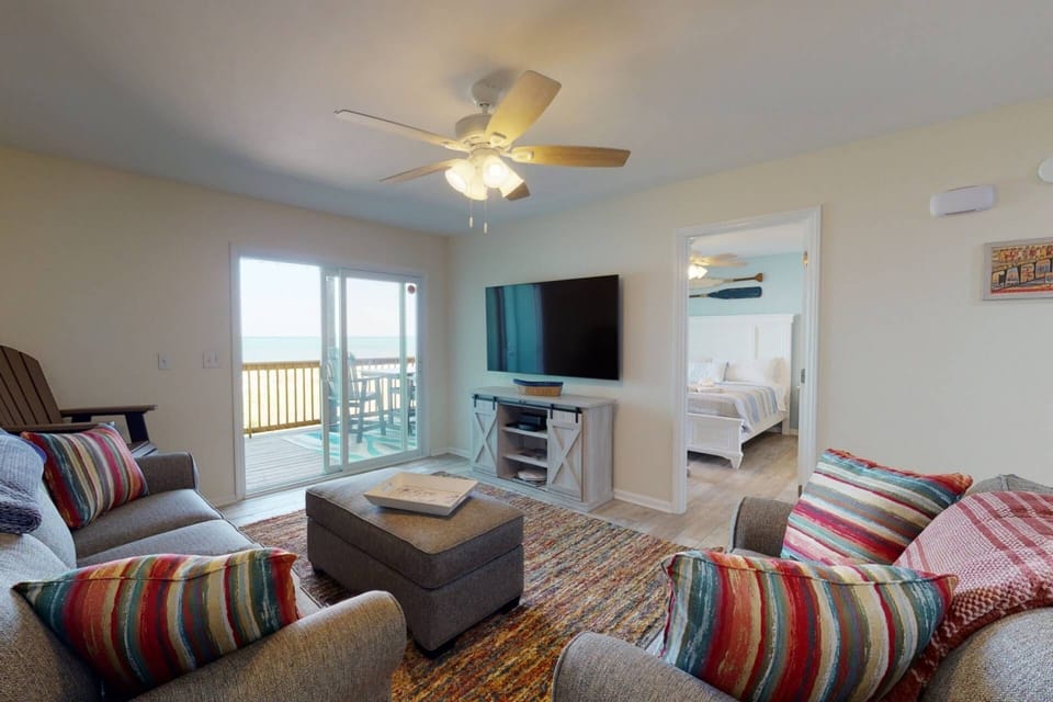 Plenty of seating in the living room with a view of the ocean