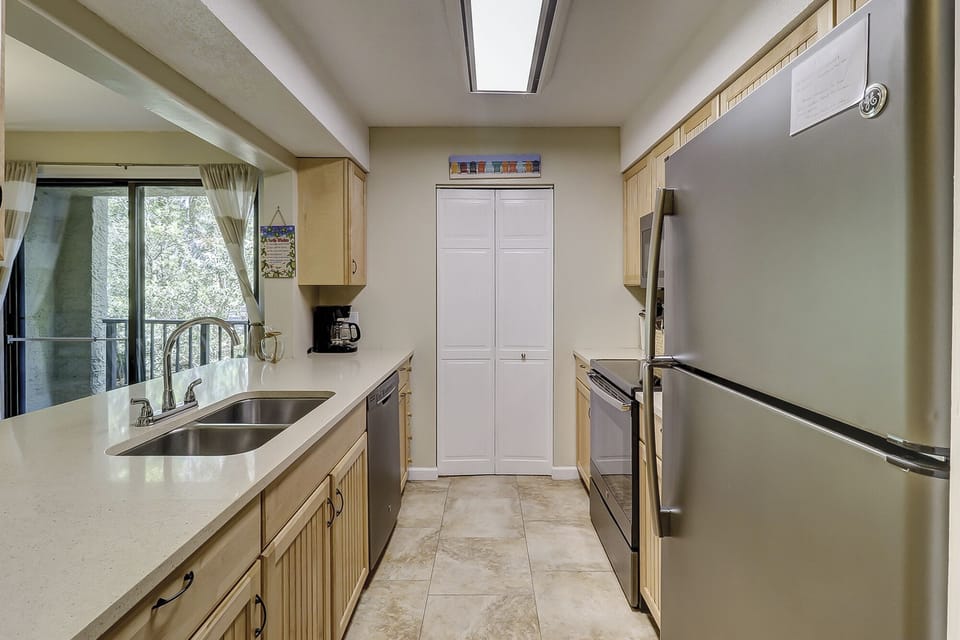Kitchen - galley kitchen that opens to the dining area.  Recently renovated.