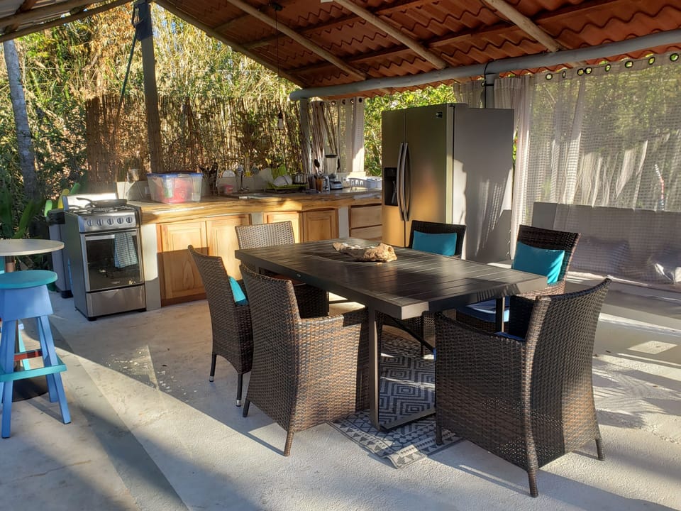 Large outdoor kitchen and dining area