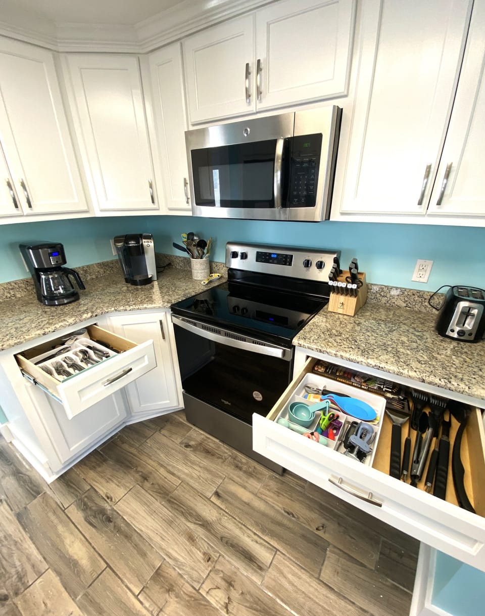 Full stocked with kitchen and grilling tools. Keurig and 12 cup coffee makers.