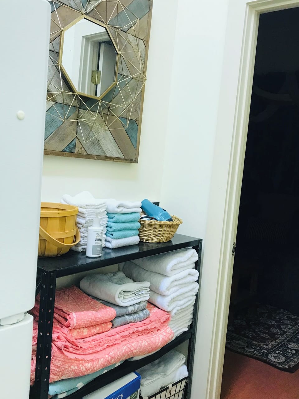 Full size refrigerator and storage room off game room
