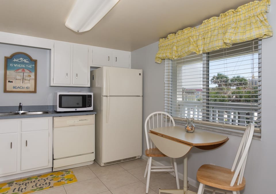 A kitchen and a table for two