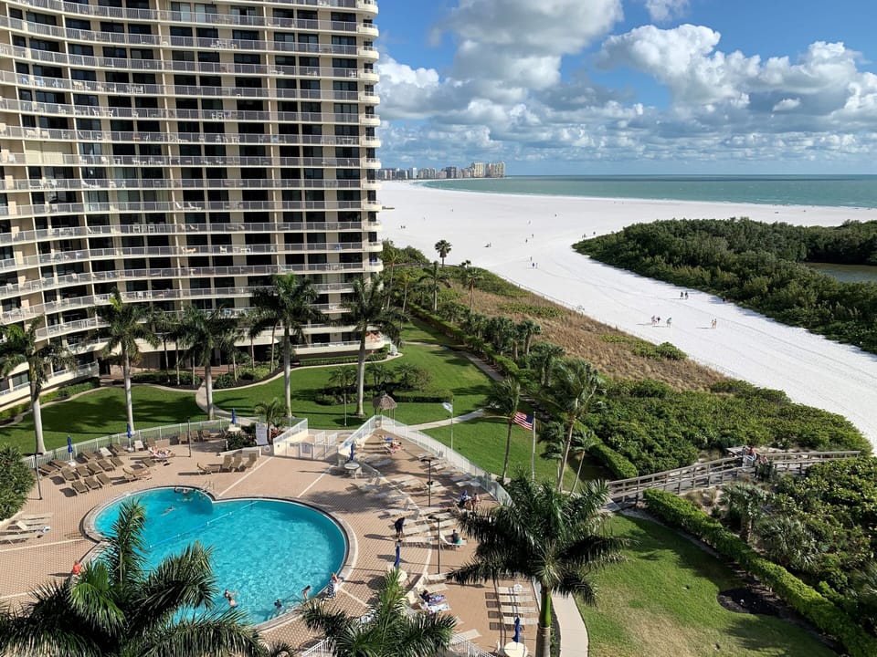 View of the pool and beach from 909 Lanai.  The perfect height!