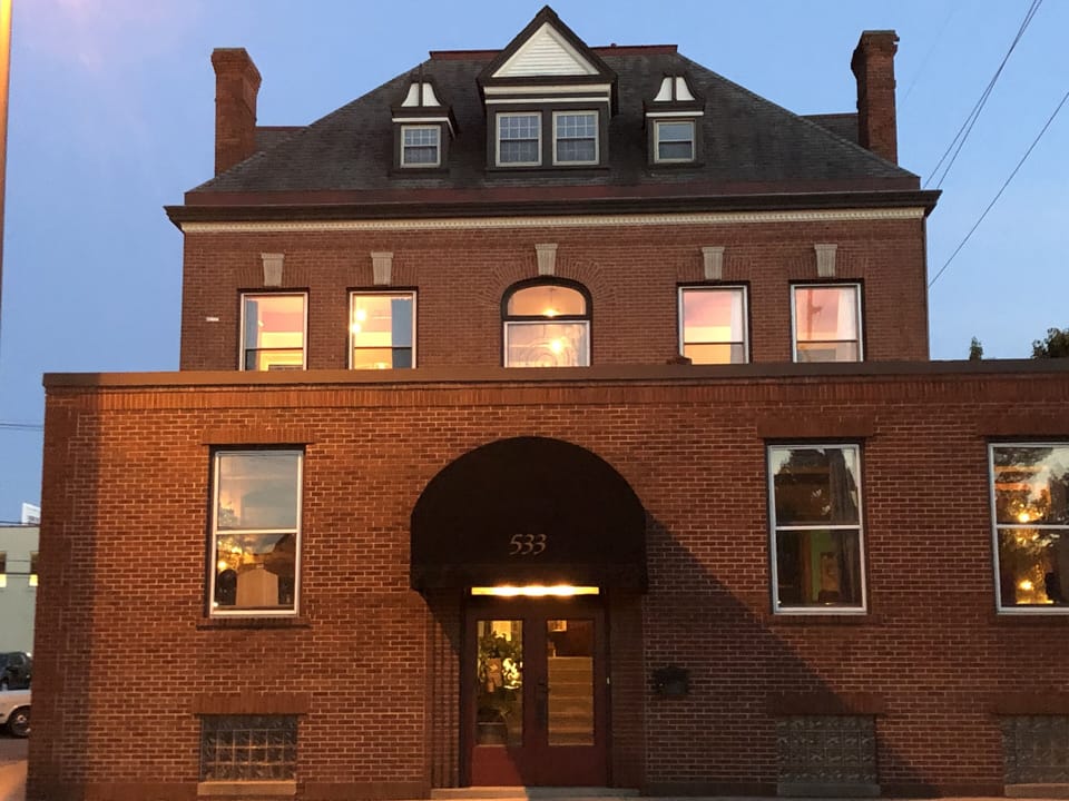 533 West Washington Blvd. entrance with coded door lock under the awning.