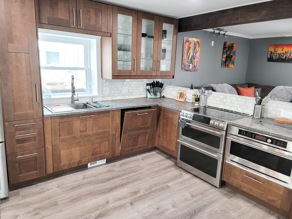 Fully equipped modern kitchen. Double oven, dishwasher, smart screen fridge. 