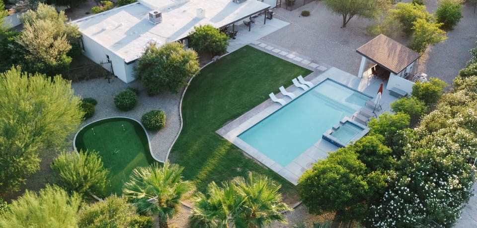 The Perfect Backyard with Pool, Spa, Putting Green, and Airstream