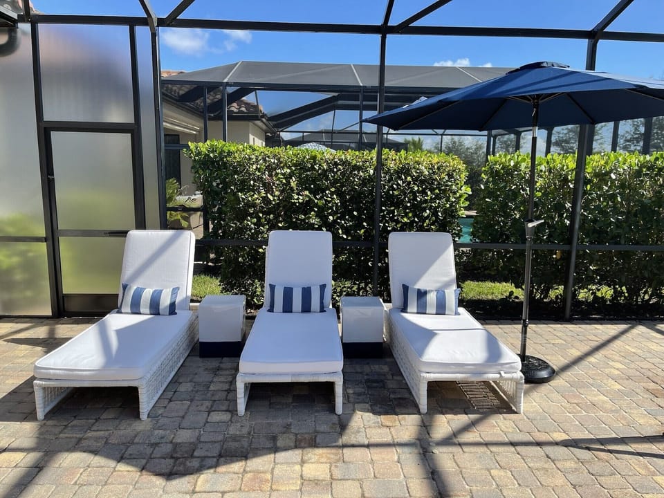 Resort style lanai area with frosted privacy screens