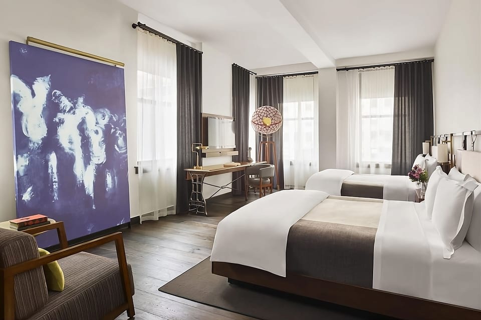 Wake up refreshed in a serene room with designer touches.