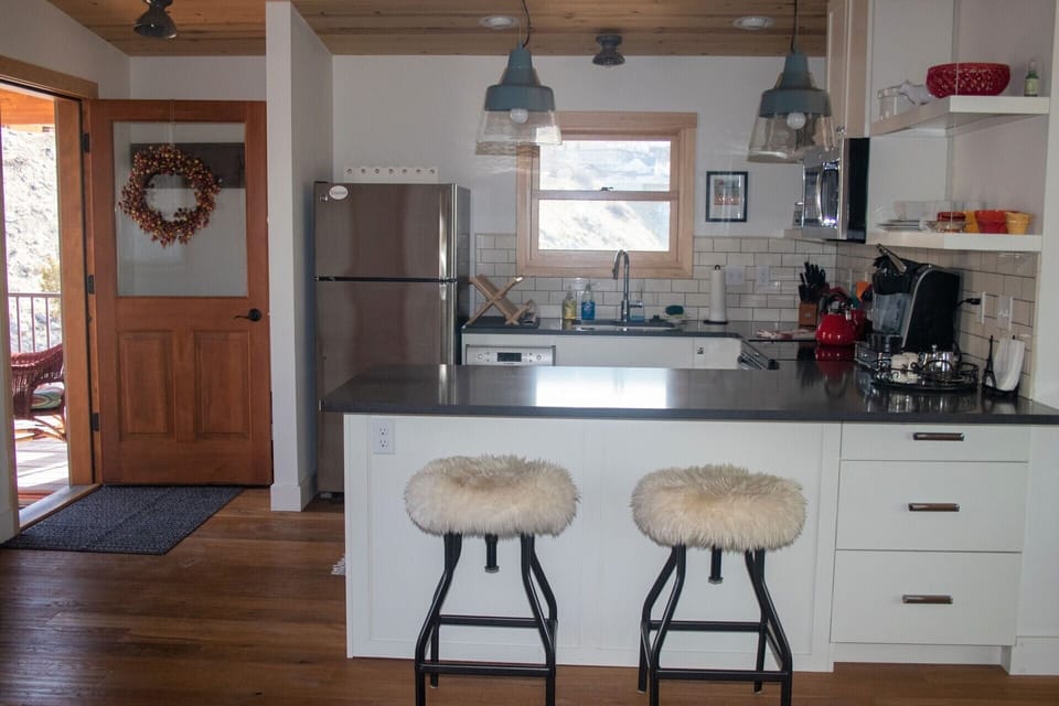 Two bar seats at the kitchen island.