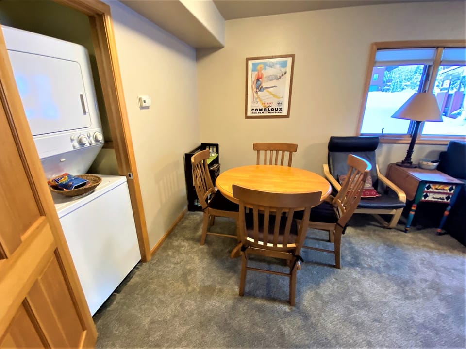 Laundry and table off of the kitchen. 
