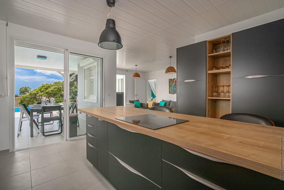 A beautiful kitchen opening onto the terrace with sea view to welcome family and friends.