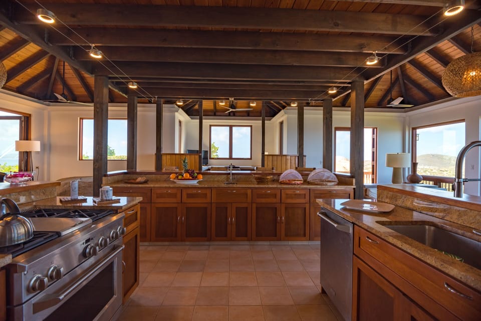 Chefs Kitchen with plenty of seating at counters that surround the kitchen
