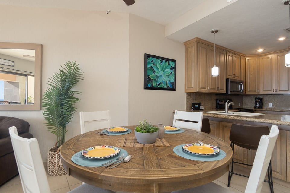 The dining table is neat he kitchen.