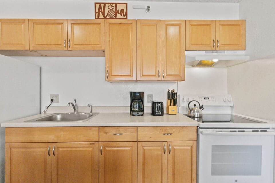 Kitchen - Full-sized refrigerator, stove/oven and microwave oven.