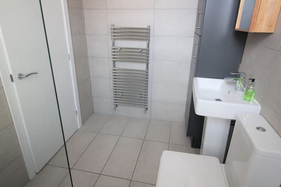Family bathroom with walk in shower.