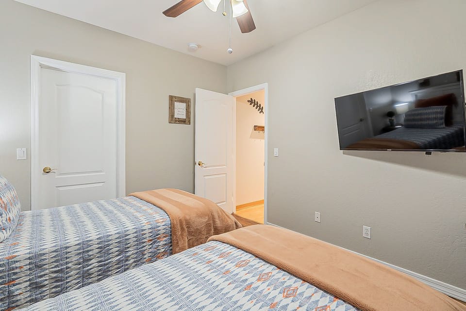 Twin beds with private TV