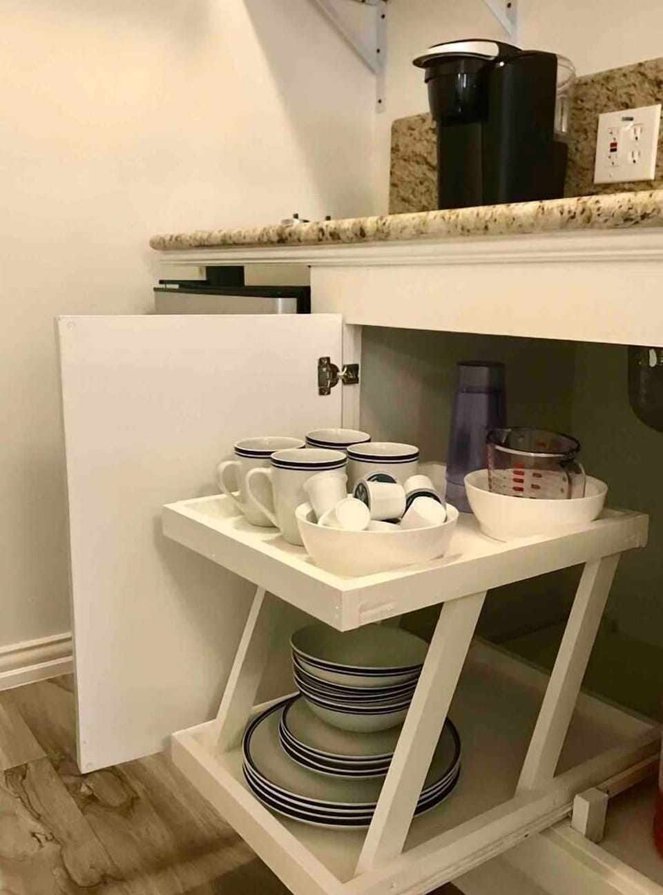 Dishes, cutlery, utensils, bottle and wine opener, k-cups, keurig, toaster oven & microwave offered