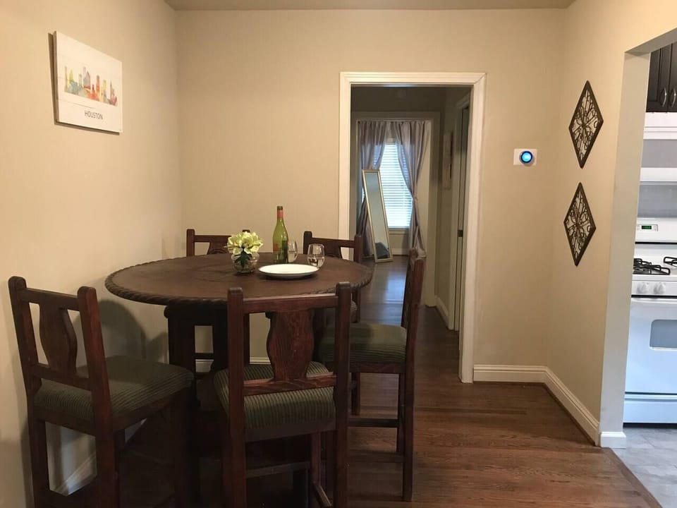 Dining table seats six. Perfect for meals, game night or to work. Nest thermostat to provide cool temps during our Texas summers.