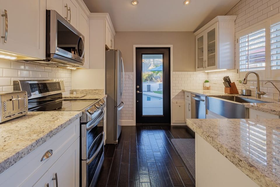 Kitchen: Well equipped, the space offers stainless steel appliances.
