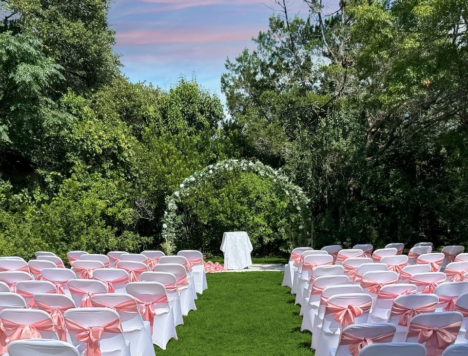 Beautiful outdoor wedding spots with moon arbor and chairs included.